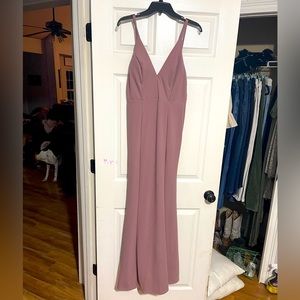 Long formal dress. Mauve/purple color. Slit on the left leg. Brand says “Simply”